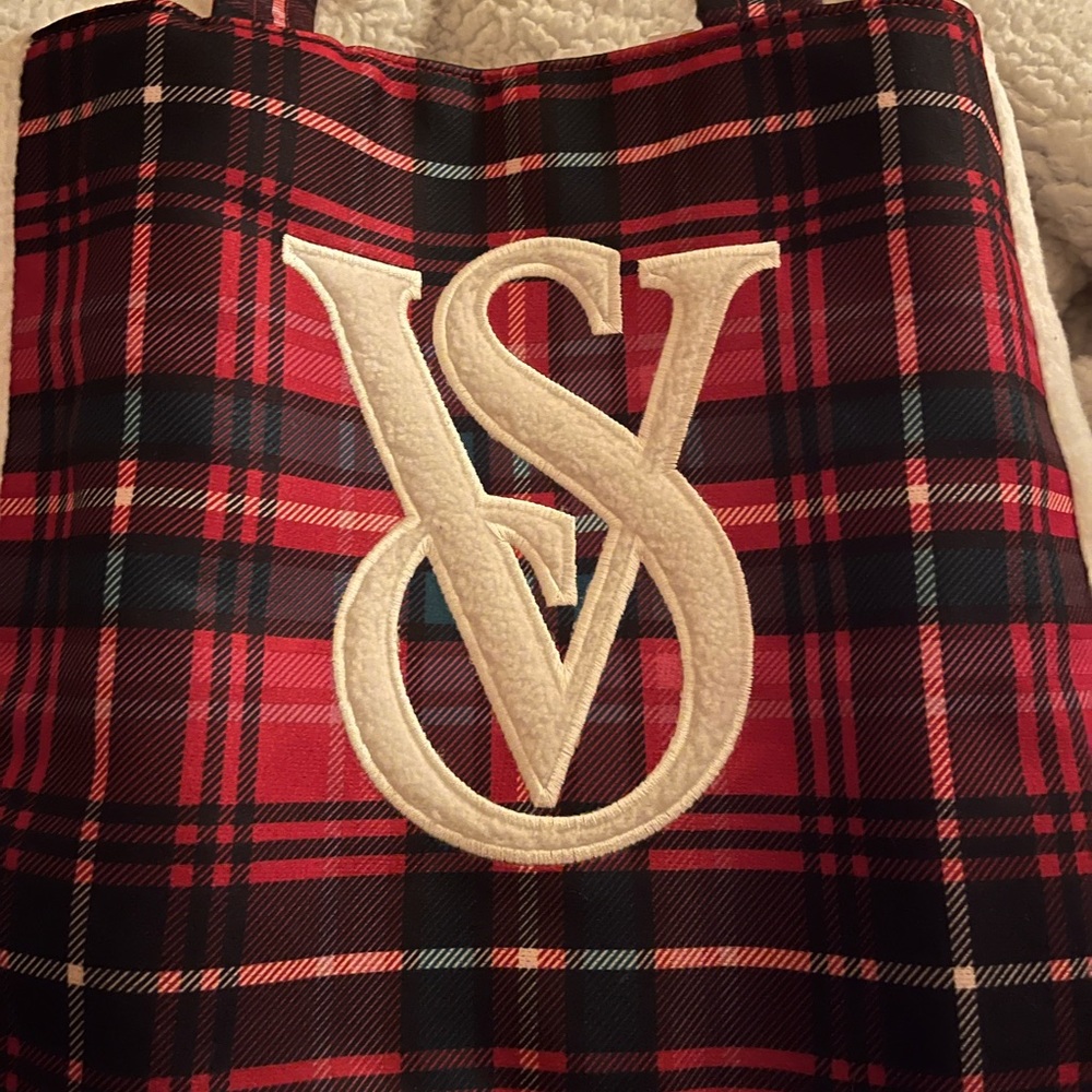 Victoria’s Secret tote bag.